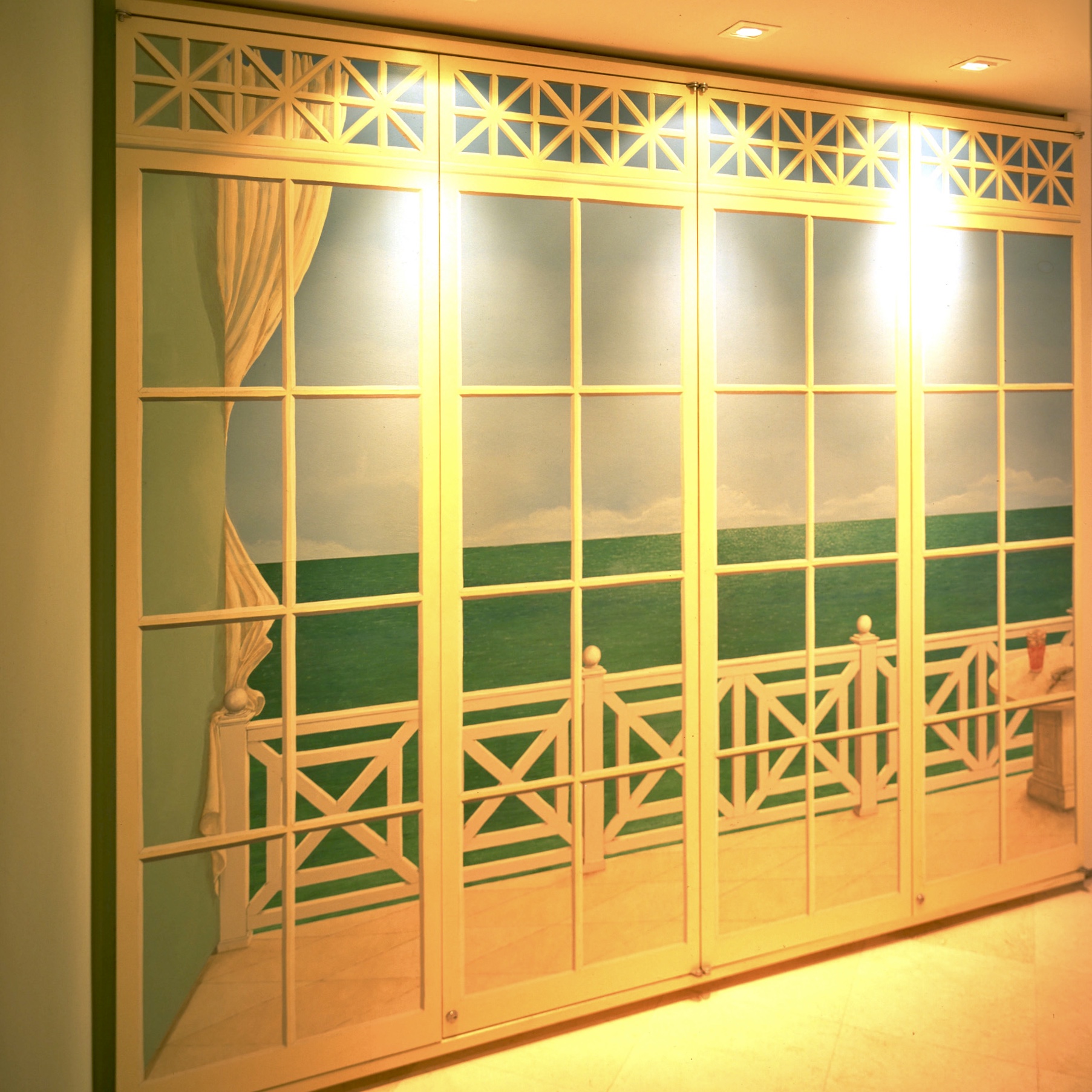 Foyer doors covering closets at Puerto Aventuras Yacht Club Penthouse by Jerry Jacobs Design.