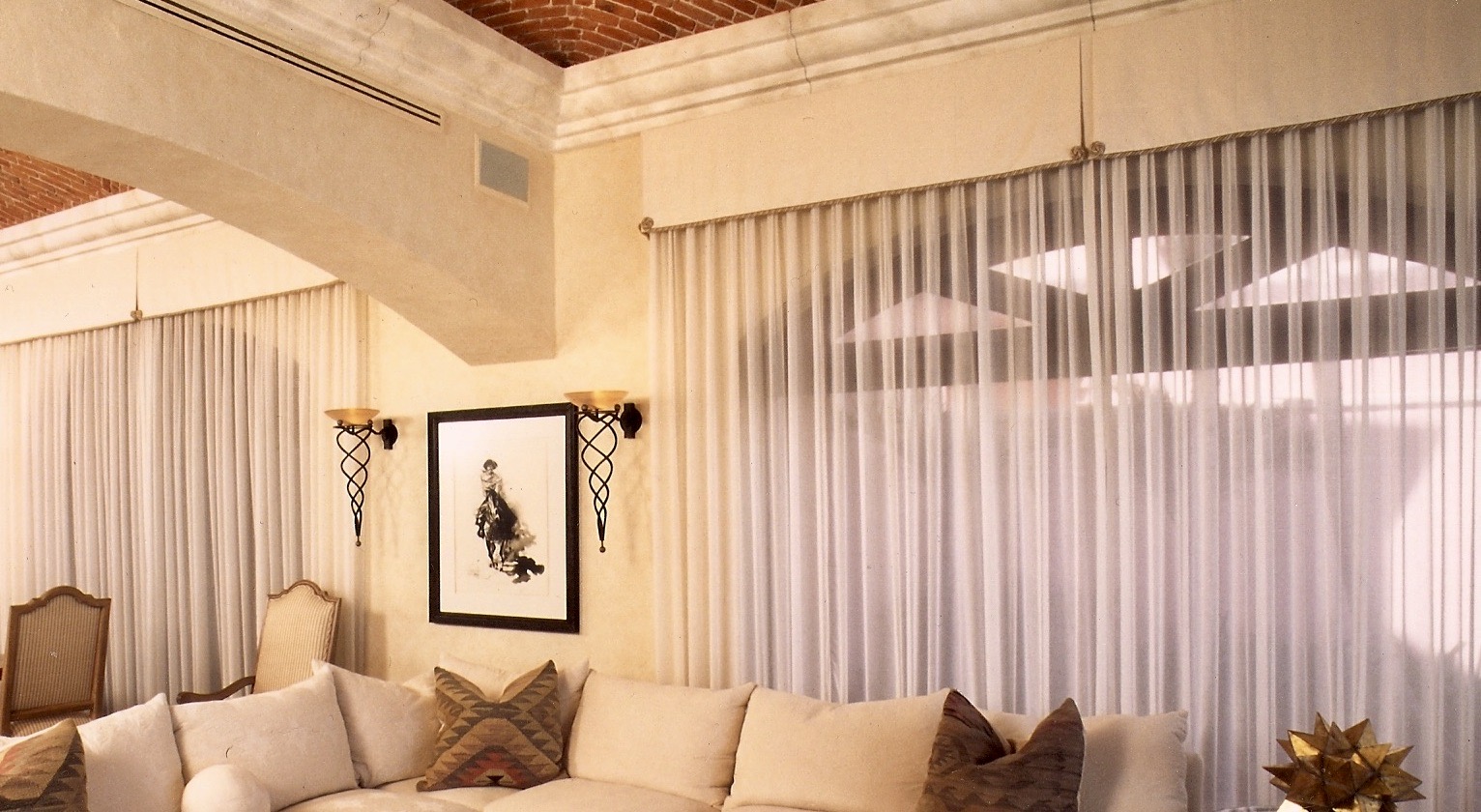 Residential high end window treatments. Sheer drapes and [leated valance. Design by Jerry Jacobs Design