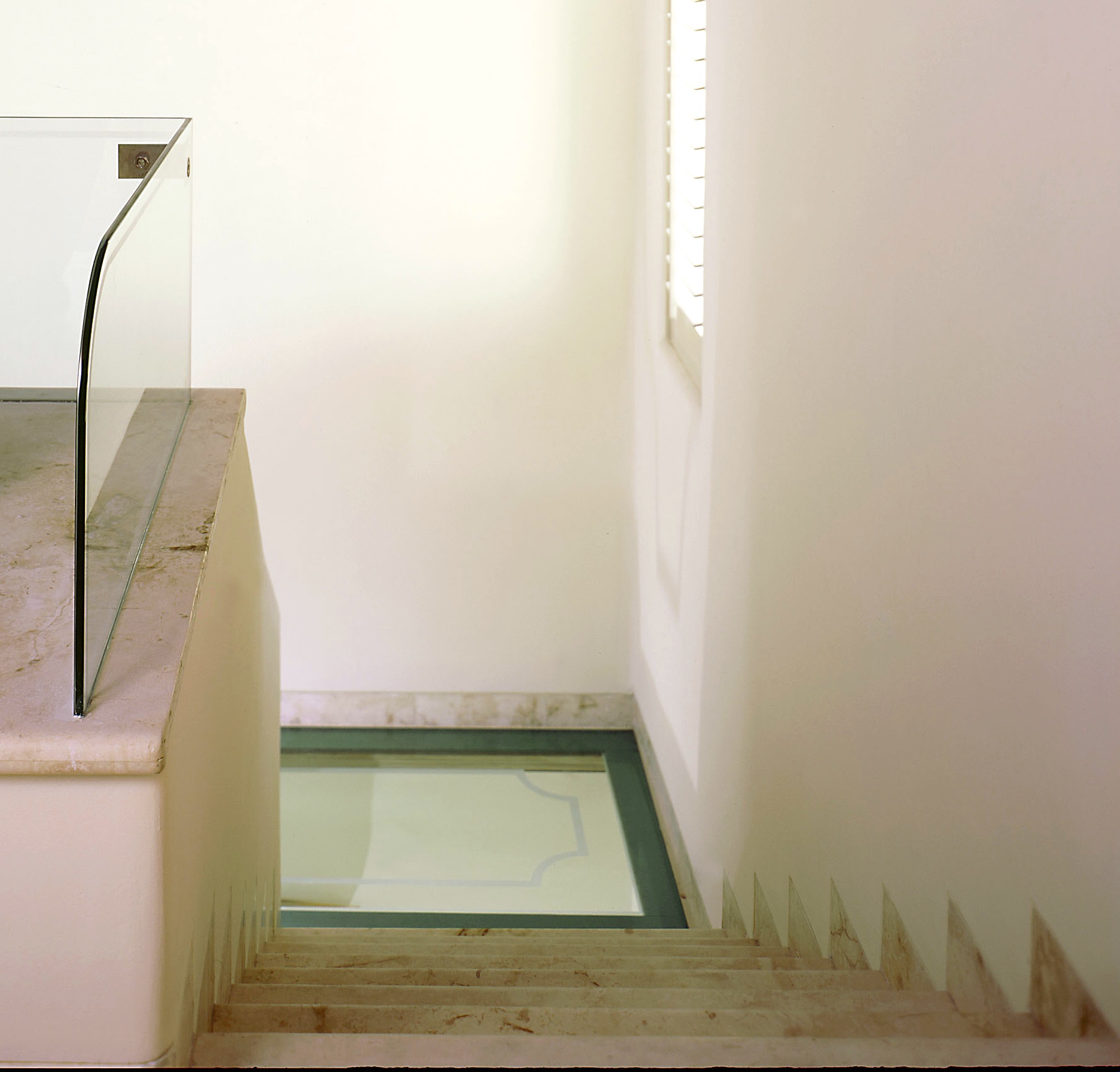 Interior Glass Floor Design in San Francisco by Jerry JACOBS DESIGN ©. Staiways landings and rail at Caribbean Townhouse.