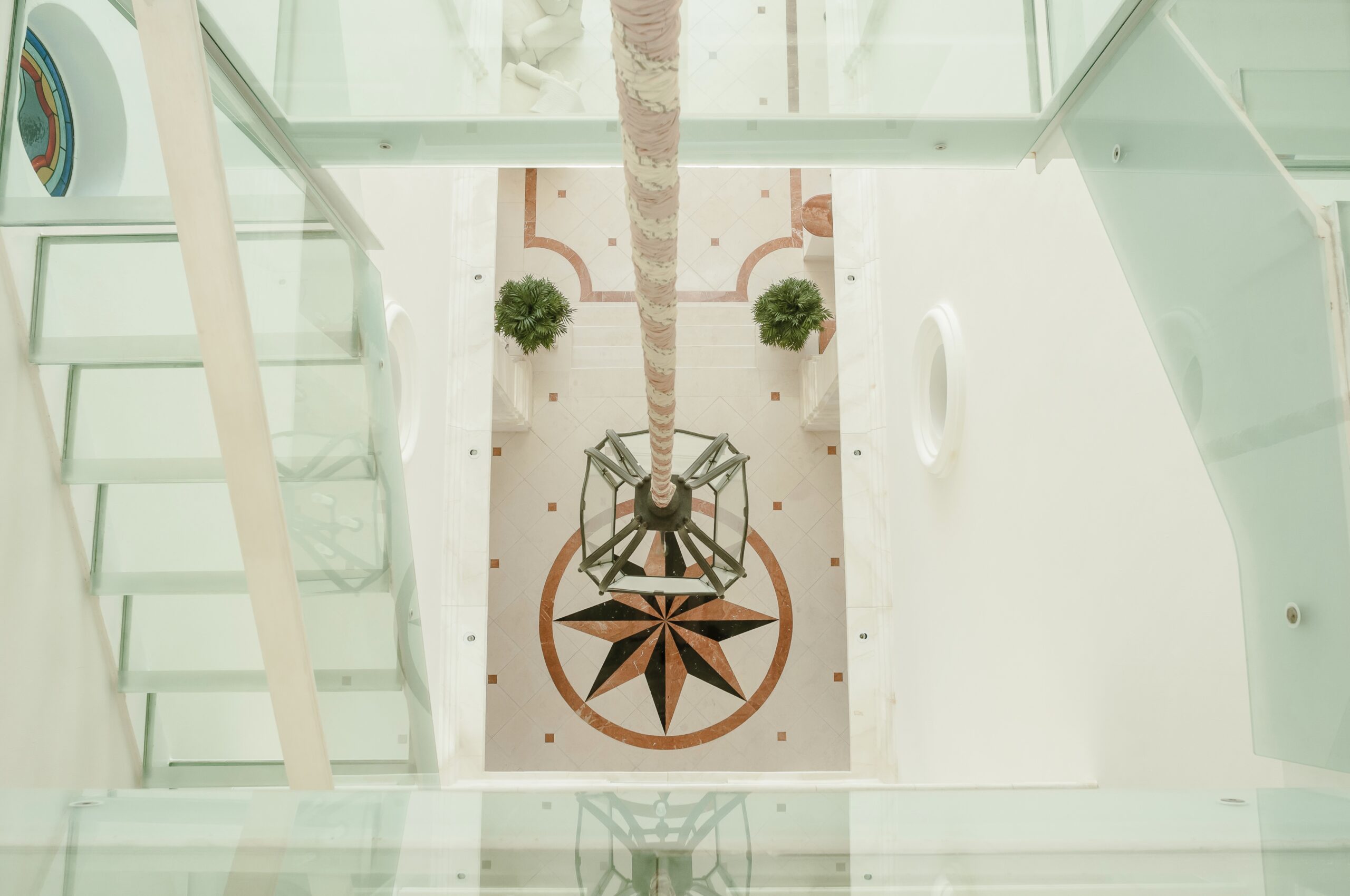 Glass floors and steps. Villa on the beach. Looking down from the Glass staircase.