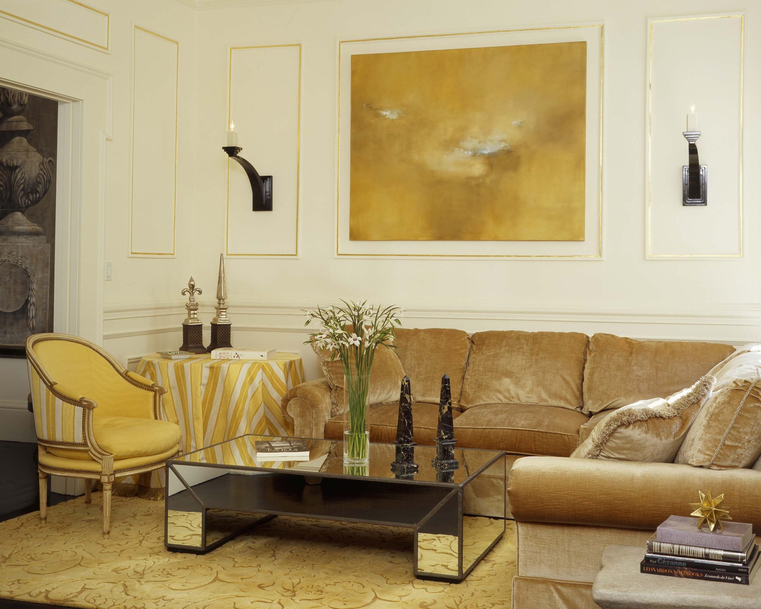 A living room with a couch, chair and table.