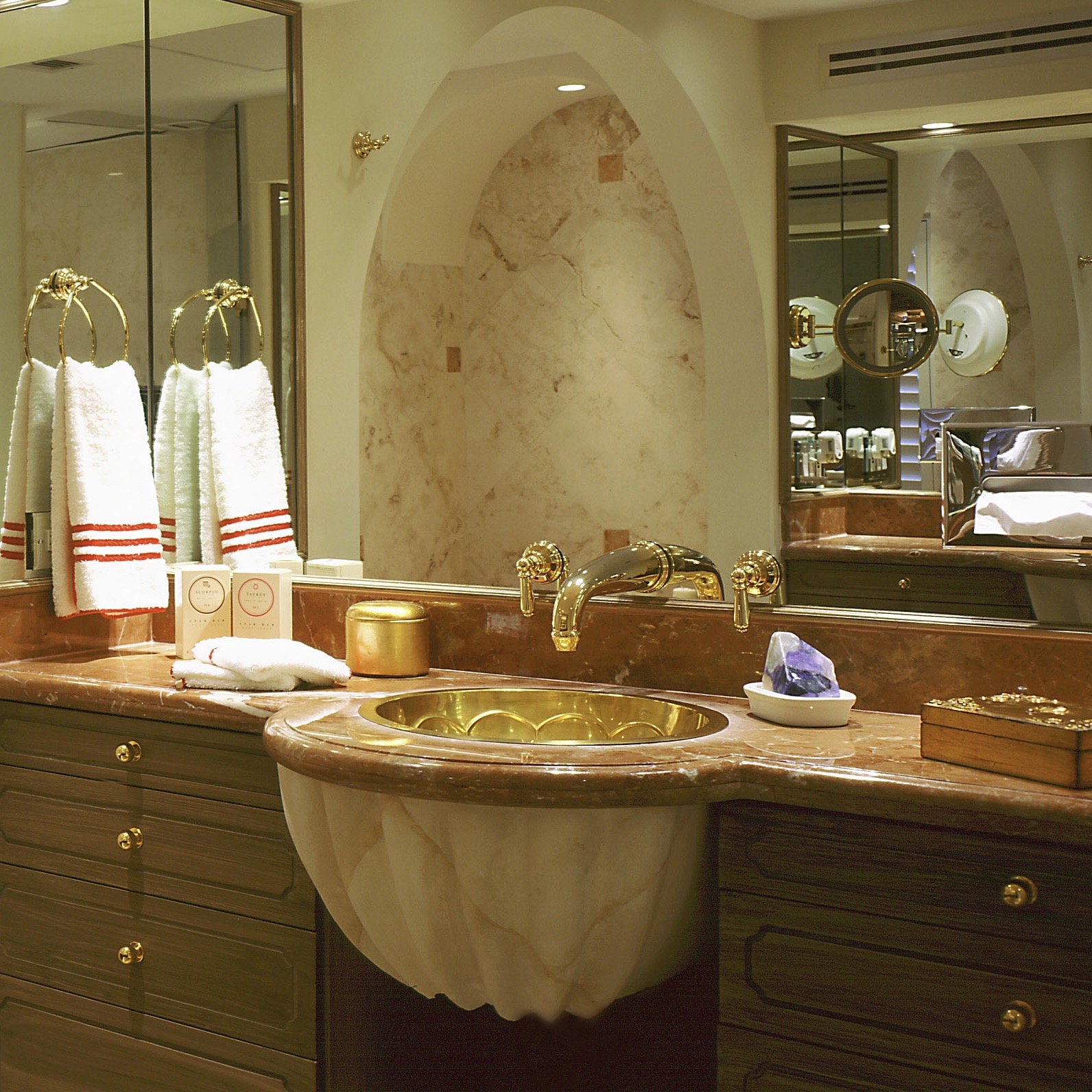 Townhouse Remodel & Interior Design. The Master bathroom has the same Rojo Alicante Marble used throughout the house in contrast to the local Crema Maya with Ticul keys on the walls likewise in other parts of the house.