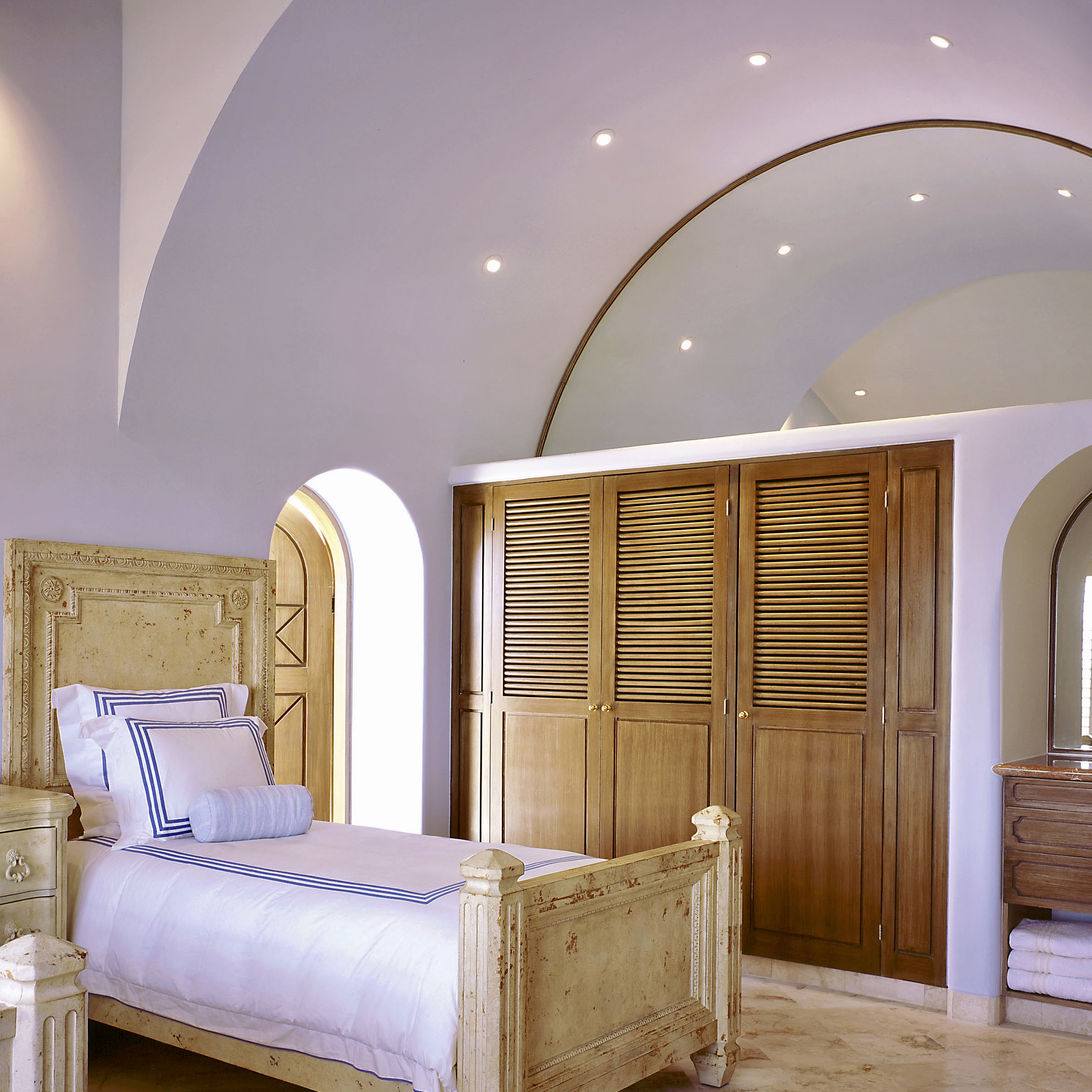 Townhouse Remodel & Interior Design. Bedroom. This bedroom on the third and top level consequently allowed us to take advantage of the pitch roof to create an Hacienda type vaulted ceiling. L Arch ceiling reflected. Furniture by Century.