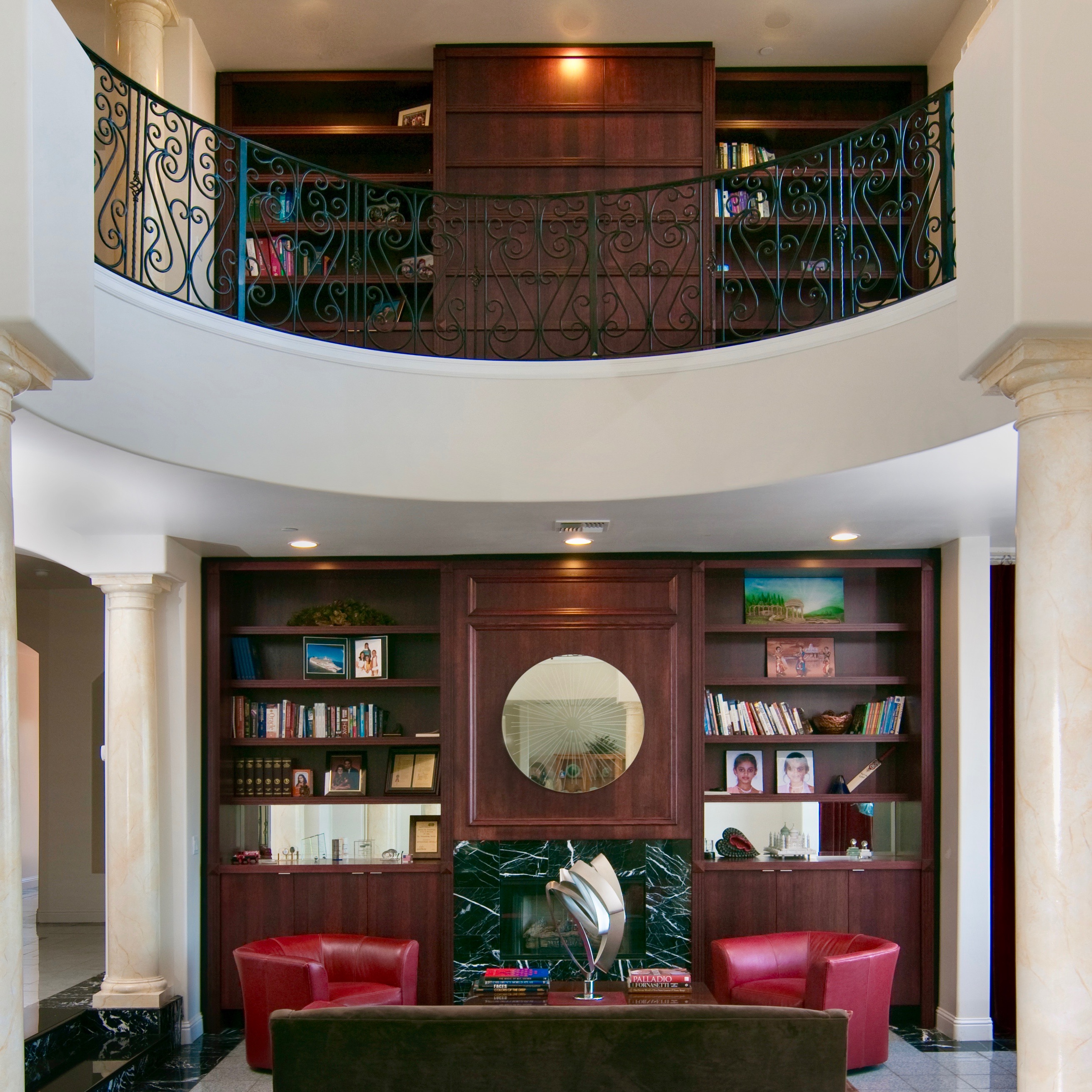 Custom home Libraries Display walls. A custom JerryJacobsDesign © 2 level library. Peninsula, San Francisco Bay.Red stained wood.