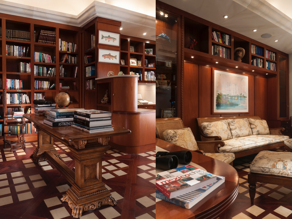 Custom home Libraries Display walls. A custom JerryJacobsDesign © library wall at Villa on the Beach, Cancun, MX. Foyer on left with carved table. Seating on right with Pierre Frey Hemisphere fabric.