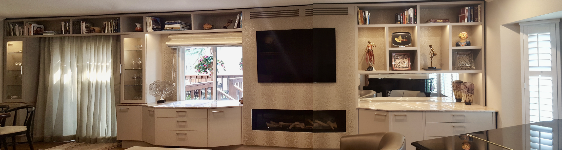 Custom home Libraries Display walls. Wall to wall home library, spans over Patio door, window and incorporstes new Fireplace and TV. Walnut Creek, California. By Jerry Jacobs Design©
