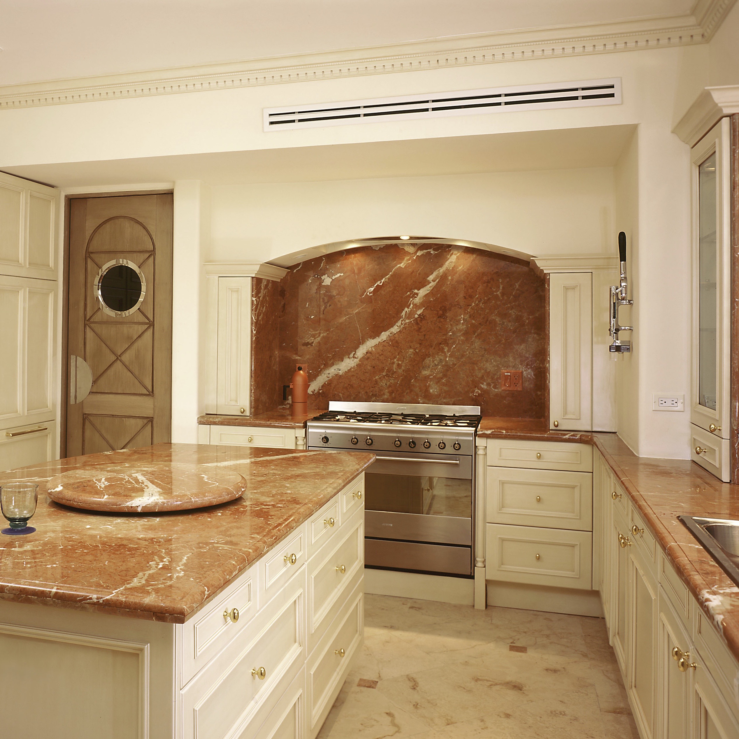 Townhouse Kitchen Rojo Alicante marble tops and Splash. Seen at British Home & Garden 2024