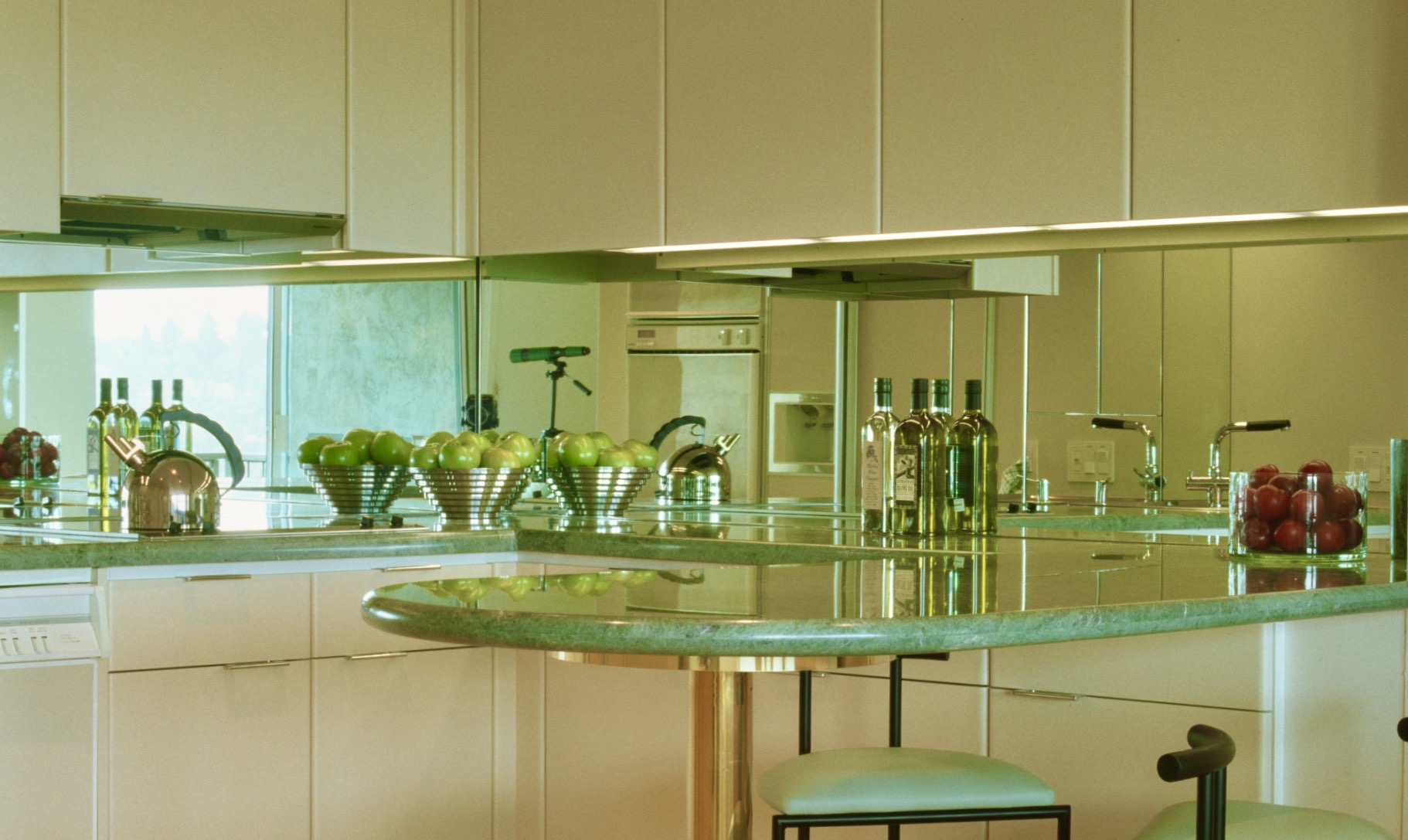 Small open Tiburon kitchen. Mirrored backsplash reflects Bay views.