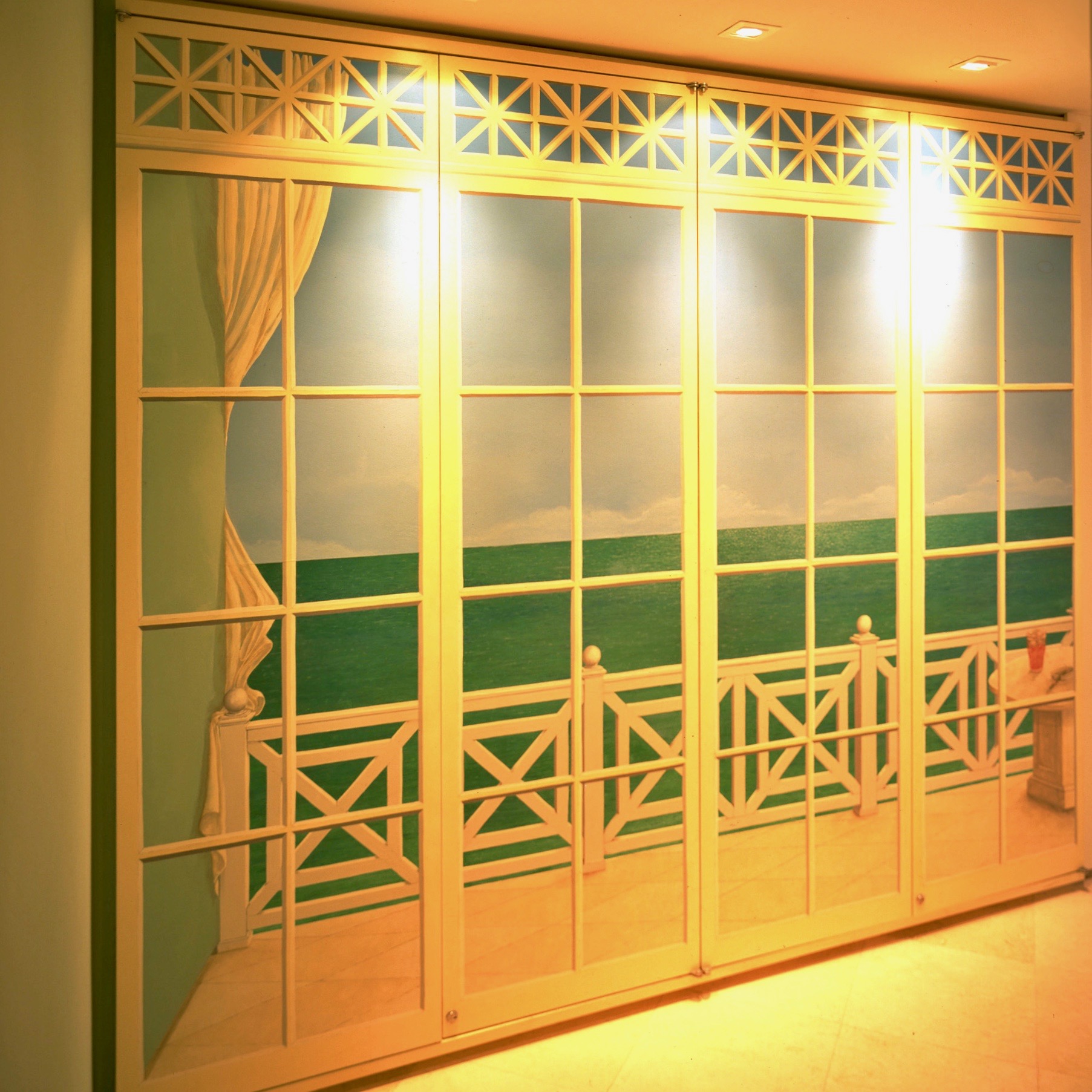 Tropical Style Interiors by Jerry Jacobs Design © Mural in door panels conceals equipment.