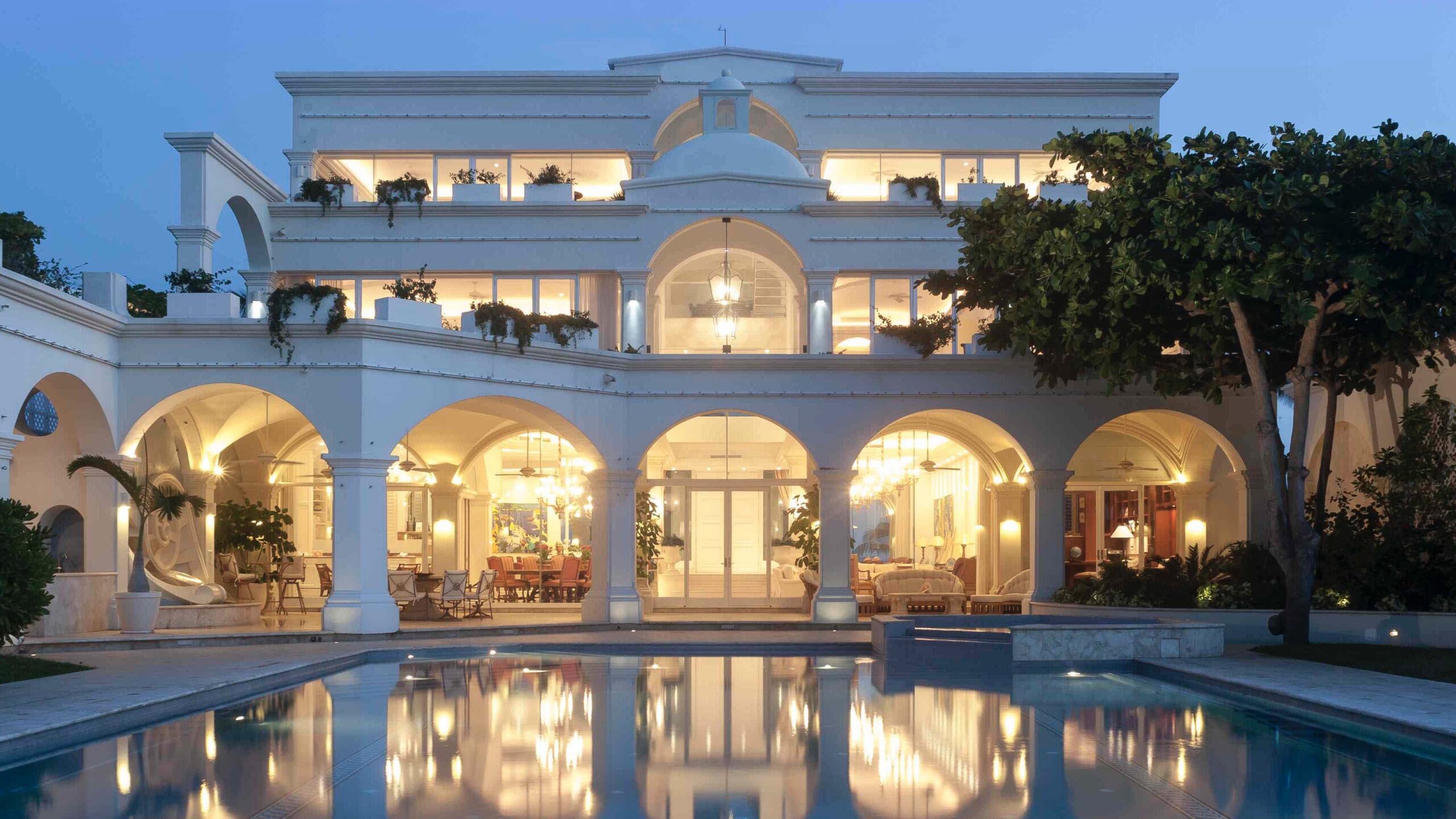 Luxury Interior Designer. Villa on the beach Ocean elevation at night. Architecture and Interior Design by Jerry Jacobs Design ©