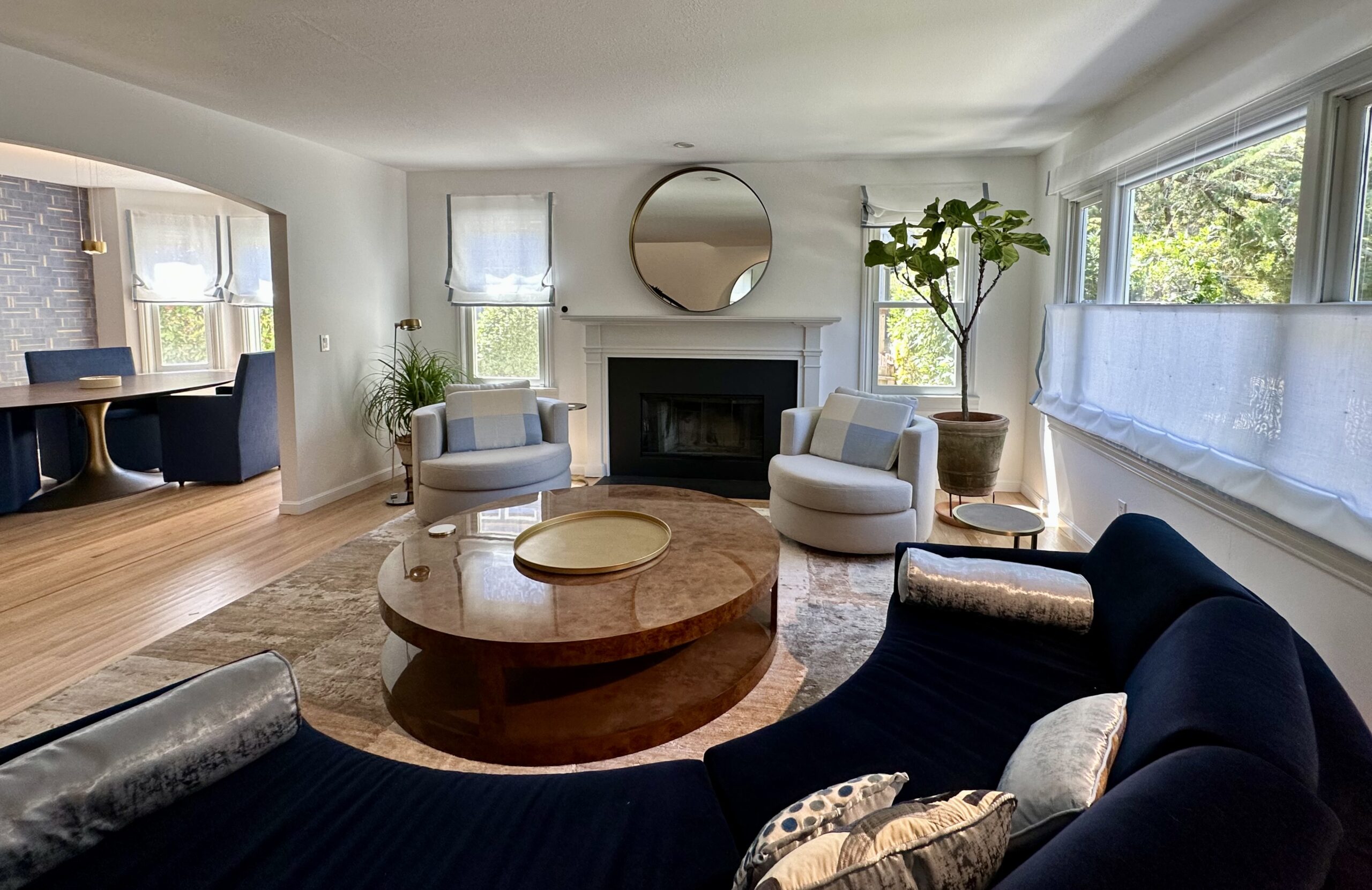 Larkspure CA, home Interiors. Licving Dining layout shows gurniture and window covering, one round mirror.Interior Design by Jerry Jacobs Design ©