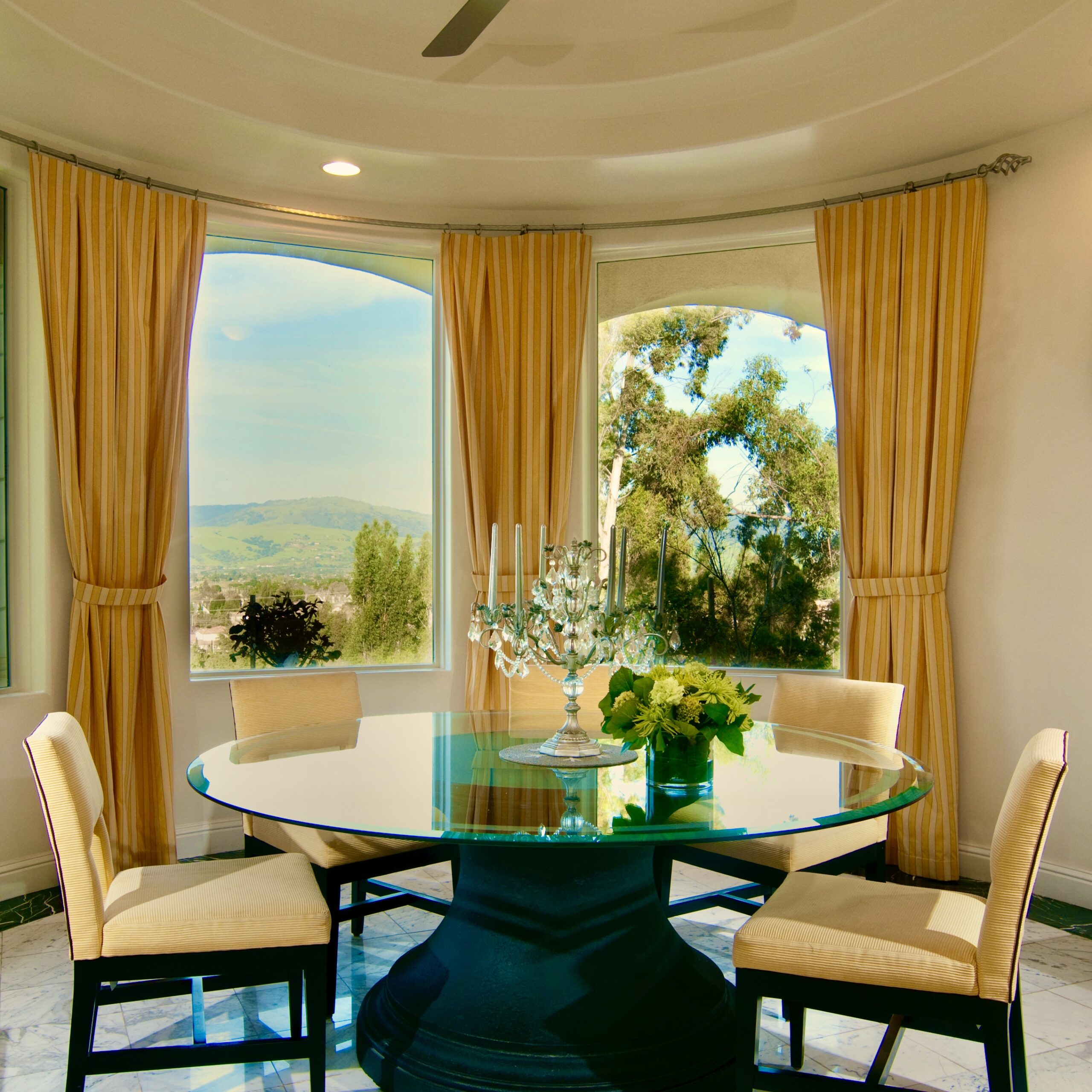 Morgan Hill dining room. 80" glass top table.