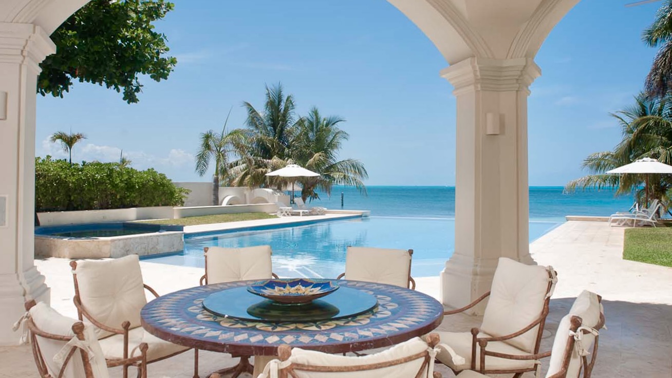 Interior Designer Dining Rooms..Outdoor Loggia seating at Villa on the Beach by Jerry Jacobs Design.