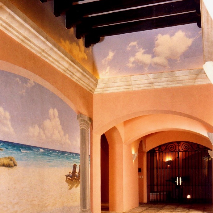 A hallway with a painting on the wall.