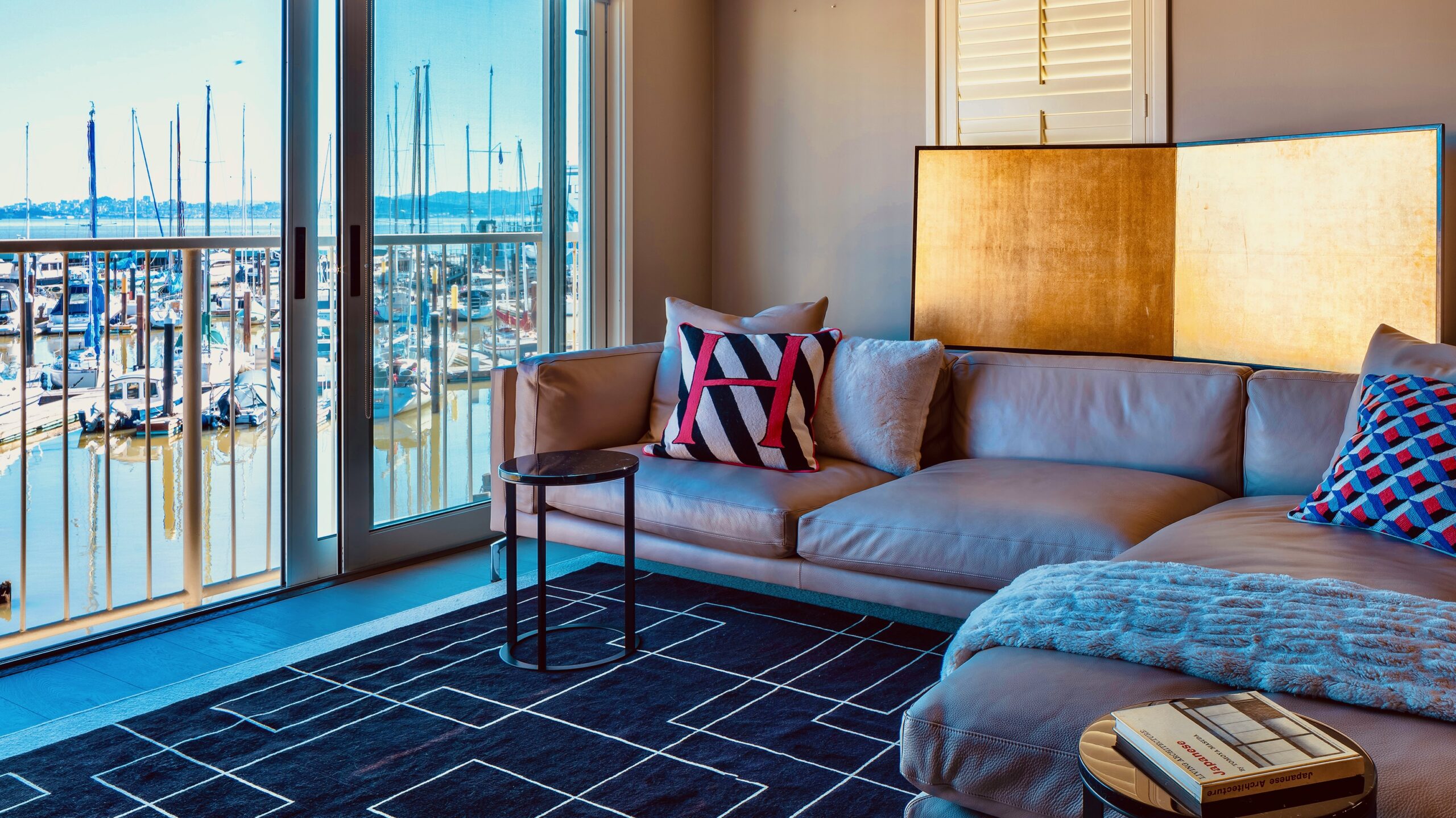 A living room with a couch and chair in it